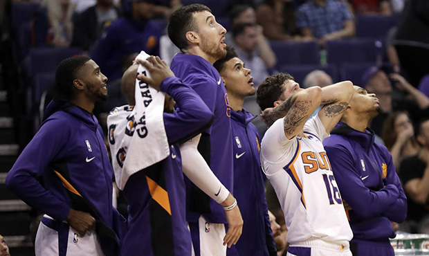 The Phoenix Suns react during the second half of an NBA basketball game against the Utah Jazz, Mond...
