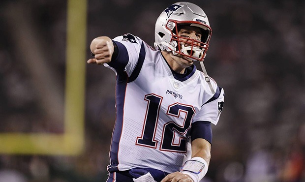 New England Patriots quarterback Tom Brady reacts to the crowd before an NFL football game against ...