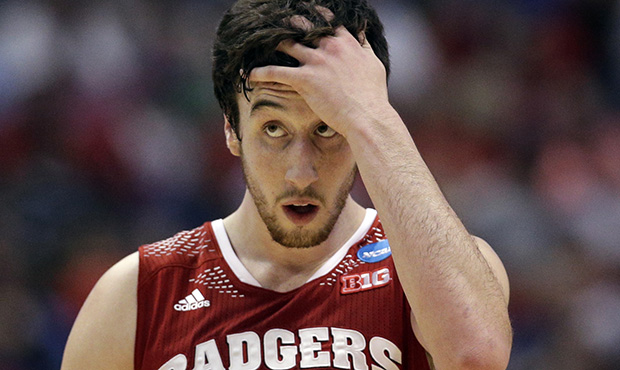Wisconsin 's Frank Kaminsky reacts during the first half in a regional final NCAA college basketbal...