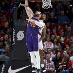 Phoenix Suns center Aron Baynes, left, is fouled by Portland Trail Blazers guard Gary Trent Jr. during the first half of a preseason NBA basketball game in Portland, Ore., Saturday, Oct. 12, 2019. (AP Photo/Craig Mitchelldyer)