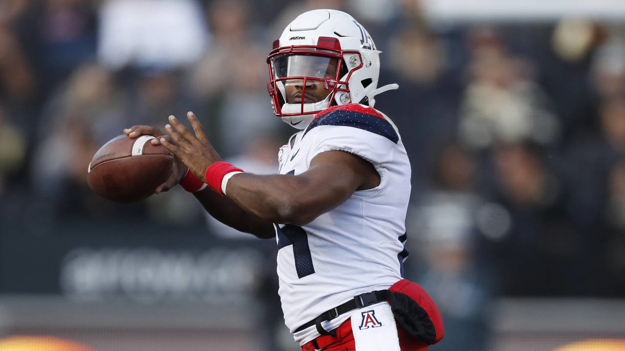 Arizona quarterback Khalil Tate throws a pass in the second half of an NCAA college football game a...