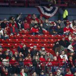 Empty seats are seen during the first inning of Game 1 of the baseball National League Championship Series between the St. Louis Cardinals and the Washington Nationals Friday, Oct. 11, 2019, in St. Louis. (AP Photo/Jeff Roberson)