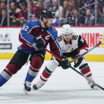 Colorado Avalanche left wing Gabriel Landeskog (92) moves the puck against Arizona Coyotes center Clayton Keller (9) during the first period of an NHL hockey game, Saturday, Oct. 12, 2019, in Denver (AP Photo/Jack Dempsey)