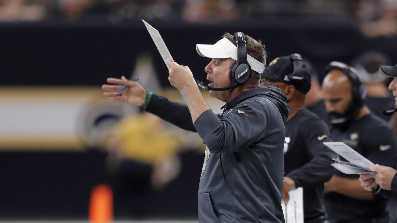 New Orleans Saints head coach Sean Payton calls out from the sideline in the first half of an NFL f...