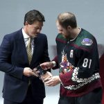 Arizona Coyotes' Phil Kessel (81) gets an award from former Coyotes player Shane Doan as the Coyotes acknowledge Kessel's 1000th NHL hockey game prior to a game against the Ottawa Senators, Saturday, Oct. 19, 2019, in Glendale, Ariz. (AP Photo/Ross D. Franklin)