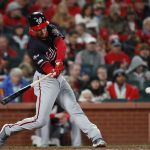 Washington Nationals' Trea Turner hits a single during the fifth inning of Game 1 of the baseball National League Championship Series against the St. Louis Cardinals Friday, Oct. 11, 2019, in St. Louis. (AP Photo/Jeff Roberson)