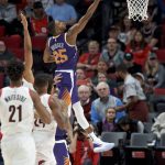 Phoenix Suns forward Mikal Bridges (25) shoots against the Portland Trail Blazers during the first half of a preseason NBA basketball game in Portland, Ore., Saturday, Oct. 12, 2019. (AP Photo/Craig Mitchelldyer)