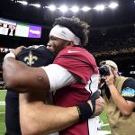 Arizona Cardinals quarterback Kyler Murray, right, hugs New Orleans Saints quarterback Drew Brees after their NFL football game in New Orleans, Sunday, Oct. 27, 2019. The Saints won 31-9. (AP Photo/Bill Feig)
