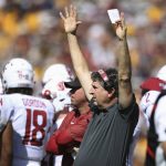 Washington State head coach Mike Leach signals for a touchdown on the sideline during the first half of an NCAA college football game against Arizona State, Saturday, Oct. 12, 2019, in Tempe, Ariz. (AP Photo/Ross D. Franklin)