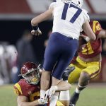 Arizona quarterback Grant Gunnell (17) is sacked by Southern California defensive lineman Nick Figueroa during the second half of an NCAA college football game Saturday, Oct. 19, 2019, in Los Angeles. (AP Photo/Marcio Jose Sanchez)