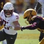 Washington State running back Max Borghi (21) runs with the ball as Arizona State linebacker Khaylan Kearse-Thomas (20) closes in for a tackle during the first half of an NCAA college football game Saturday, Oct. 12, 2019, in Tempe, Ariz. (AP Photo/Ross D. Franklin)