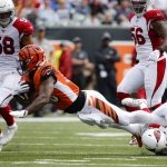 Cincinnati Bengals running back Joe Mixon (28) is tackled by Arizona Cardinals defensive back Jalen Thompson (34) in the first half of an NFL football game, Sunday, Oct. 6, 2019, in Cincinnati. (AP Photo/Frank Victores)