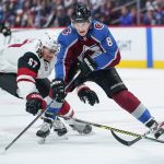 Colorado Avalanche defenseman Cale Makar (8) moves the puck upice against Arizona Coyotes left wing Lawson Crouse (67) during the first period of an NHL hockey game, Saturday, Oct. 12, 2019, in Denver (AP Photo/Jack Dempsey)