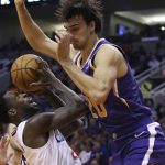 LA Clippers guard Patrick Beverley, left, gets fouled by Phoenix Suns forward Dario Saric (20) as Beverley goes up for a shot during the first half of a basketball game Saturday, Oct. 26, 2019, in Phoenix. (AP Photo/Ross D. Franklin)