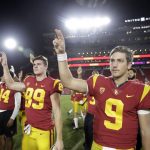 Southern California quarterback Kedon Slovis (9) and tight end Sean Mahoney (89) celebrate after a 41-14 win over Arizona during an NCAA college football game Saturday, Oct. 19, 2019, in Los Angeles. (AP Photo/Marcio Jose Sanchez)