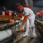 St. Louis Cardinals' Marcell Ozuna warms up during the seventh inning of Game 1 of the baseball National League Championship Series against the Washington Nationals Friday, Oct. 11, 2019, in St. Louis. (AP Photo/Jeff Roberson)