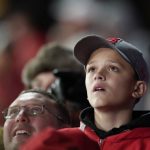 A young St. Louis Cardinals fan watches during the ninth inning of Game 1 of the baseball National League Championship Series against the Washington Nationals Friday, Oct. 11, 2019, in St. Louis. (AP Photo/Charlie Riedel)