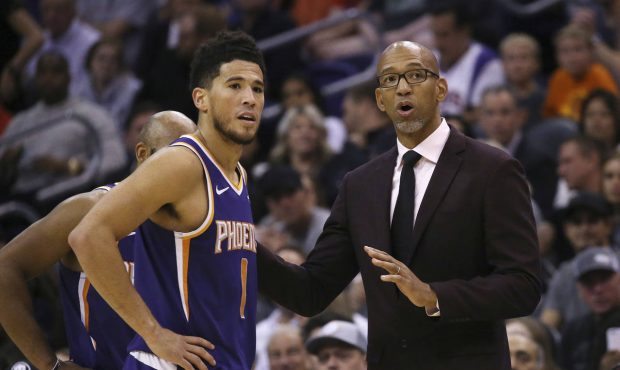 Phoenix Suns head coach Monty Williams, right, talks with Suns guard Devin Booker (1) during the se...