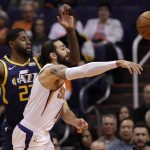 Phoenix Suns guard Ricky Rubio, second from right, passes as Utah Jazz forward Royce O'Neale, left, defends during the first half of an NBA basketball game, Monday, Oct. 28, 2019, in Phoenix. (AP Photo/Matt York)