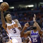 Phoenix Suns forward Kelly Oubre Jr. shoots over Sacramento Kings forward Marvin Bagley III (35) during the second half of an NBA basketball game Wednesday, Oct. 23, 2019, in Phoenix. (AP Photo/Rick Scuteri)