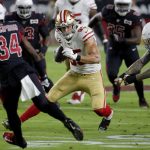 San Francisco 49ers tight end George Kittle (85) tries to avoid Arizona Cardinals defenders during the first half of an NFL football game, Thursday, Oct. 31, 2019, in Glendale, Ariz. (AP Photo/Rick Scuteri)