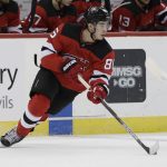 New Jersey Devils' Jack Hughes (86) looks to pass the puck during the first period of the team's NHL hockey game against the Arizona Coyotes on Friday, Oct. 25, 2019, in Newark, N.J. (AP Photo/Frank Franklin II)