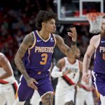 Phoenix Suns forward Kelly Oubre Jr. reacts after making a basket against the Portland Trail Blazers during the first half of a preseason NBA basketball game in Portland, Ore., Saturday, Oct. 12, 2019. (AP Photo/Craig Mitchelldyer)