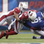 New York Giants quarterback Daniel Jones, right, is sacked by Arizona Cardinals' Jordan Hicks, left, and Chandler Jones (55) during the first half of an NFL football game, Sunday, Oct. 20, 2019, in East Rutherford, N.J. (AP Photo/Adam Hunger)