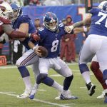 New York Giants quarterback Daniel Jones, center, tries to evade the Arizona Cardinals defense during the second half of an NFL football game, Sunday, Oct. 20, 2019, in East Rutherford, N.J. (AP Photo/Bill Kostroun)