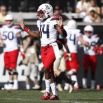 Arizona quarterback Khalil Tate, front, reacts after throwing for a touchdown against Colorado in the first half of an NCAA college football game Saturday, Oct. 5, 2019, in Boulder, Colo. (AP Photo/David Zalubowski)