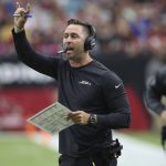 Arizona Cardinals head coach Kliff Kingsbury makes a call during the first half of an NFL football game against the Atlanta Falcons, Sunday, Oct. 13, 2019, in Glendale, Ariz. (AP Photo/Ross D. Franklin)