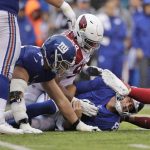 New York Giants quarterback Daniel Jones, center bottom is tackled by the Arizona Cardinals defense during the second half of an NFL football game, Sunday, Oct. 20, 2019, in East Rutherford, N.J. (AP Photo/Adam Hunger)