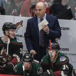 Arizona Coyotes head coach Rick Tocchet talks to his bench during the third period of an NHL hockey game Saturday, Oct. 5, 2019, in Glendale, Ariz. (AP Photo/Darryl Webb)