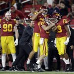Southern California's Damon Johnson (59) celebrates with teammates after recovering a fumble on a punt during the first half of the team's NCAA college football game against Arizona on Saturday, Oct. 19, 2019, in Los Angeles. (AP Photo/Marcio Jose Sanchez)
