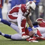 Arizona Cardinals' Haason Reddick recovers a fumble forced by teammate Patrick Peterson during the second half of an NFL football game against the New York Giants, Sunday, Oct. 20, 2019, in East Rutherford, N.J. (AP Photo/Adam Hunger)