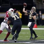 New Orleans Saints quarterback Drew Brees (9) passes as offensive tackle Ryan Ramczyk (71) blocks Arizona Cardinals linebacker Chandler Jones (55) in the first half of an NFL football game in New Orleans, Sunday, Oct. 27, 2019. (AP Photo/Butch Dill)