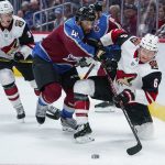 Arizona Coyotes defenseman Jakob Chychrun (6) shoots from a knee as Colorado Avalanche left wing Pierre-Edouard Bellemare (41) connects during the first period of an NHL hockey game, Saturday, Oct. 12, 2019, in Denver (AP Photo/Jack Dempsey)