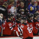 New Jersey Devils' Jack Hughes (86) celebrates with teammates after scoring a goal during the first period of the team's NHL hockey game against the Arizona Coyotes on Friday, Oct. 25, 2019, in Newark, N.J. (AP Photo/Frank Franklin II)