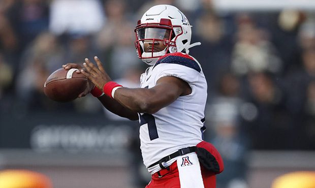 Arizona quarterback Khalil Tate throws a pass in the second half of an NCAA college football game a...