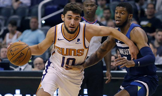 Phoenix Suns guard Ty Jerome (10) drives on Minnesota Timberwolves guard Tyrone Wallace during the ...