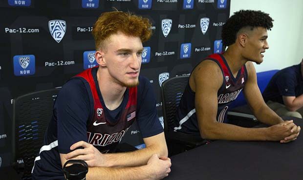 Arizona's Nico Mannion, left, and Josh Green speak during the Pac-12 NCAA college basketball media ...