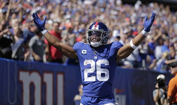 New York Giants' Saquon Barkley celebrates his touchdown during the first half of an NFL football g...