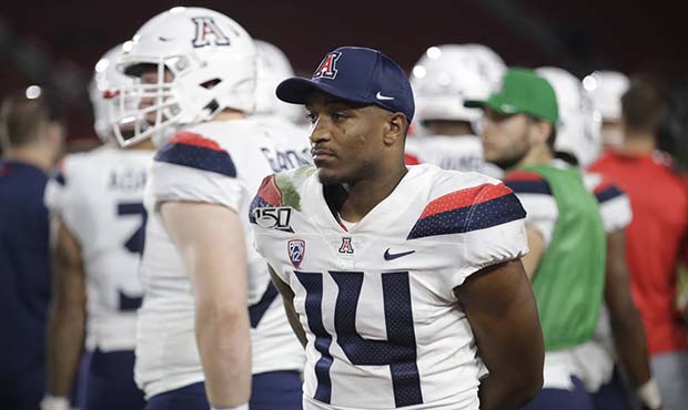 Arizona quarterback Khalil Tate (14) watches from the sideline as his team plays Southern Californi...