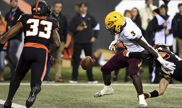 Arizona State running back Eno Benjamin (3) fumbles the ball near the goal line after being hit by ...