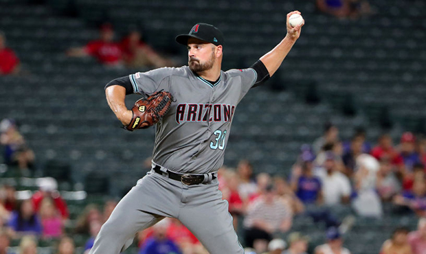 T.J. McFarland #30 of the Arizona Diamondbacks pitches against the Texas Rangers in the bottom of t...