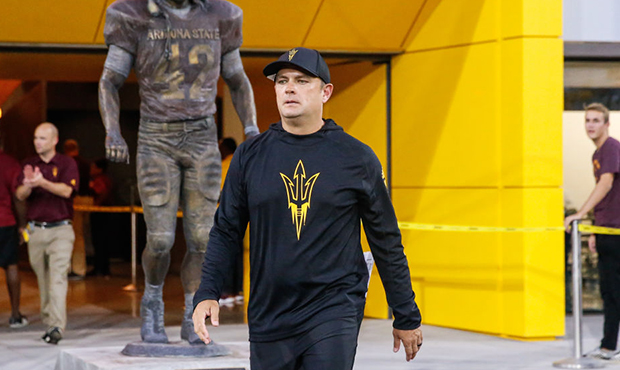 Arizona State Sun Devils defensive coordinator Danny Gonzales walks to the field in front of the Pa...