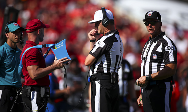 Officials review the catch by Larry Fitzgerald #11 of the Arizona Cardinals during the game between...