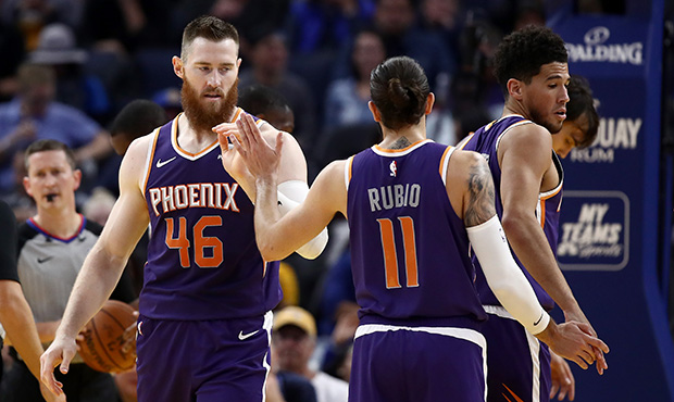 Aron Baynes #46 of the Phoenix Suns is congratulated by Ricky Rubio #11 after he made a basket agai...