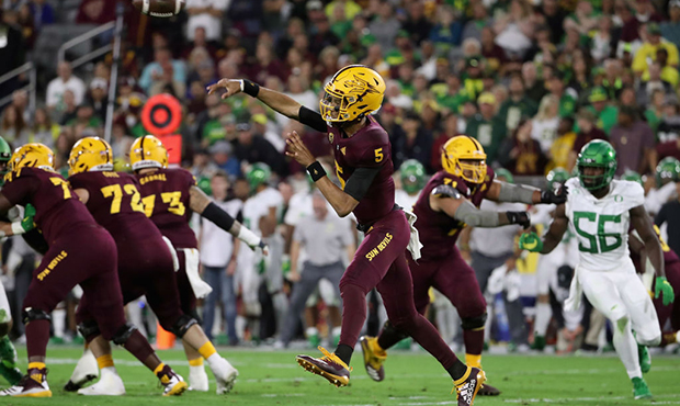 Quarterback Jayden Daniels #5 of the Arizona State Sun Devils throws a pass during the first half o...