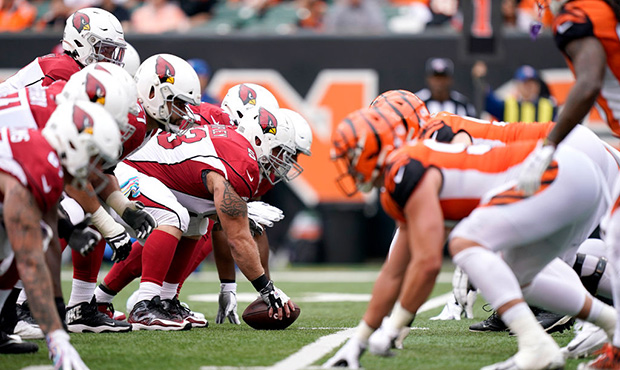 The Arizona Cardinals and Cincinnati Bengals line up at the line of scrimmage during the first half...